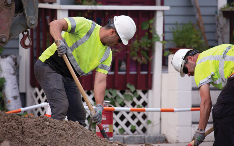 Workers hand digging