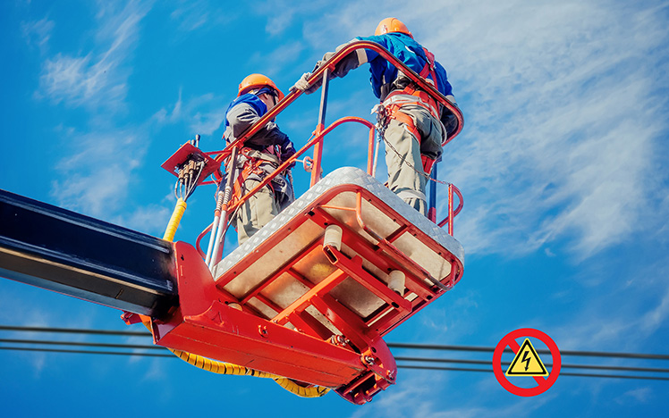 Workers on manlift near power lines